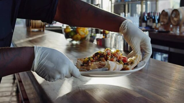 Close-Up 4K Ultra HD Video of Man Turning Ceviche Plate to Camera