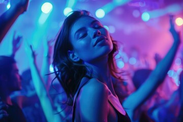 A woman is dancing in a club with a crowd of people. She is smiling and she is enjoying herself. The atmosphere is lively and energetic, with people dancing and having a good time