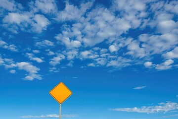 Australian Made Sign on Yellow Road Sign with Blue Sky and White Clouds