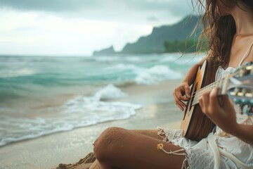 Young woman playing guitar on the beach