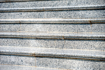 steps of an empty stone granite staircase close up