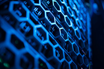 close up of network cables connected to server racks in data center room.