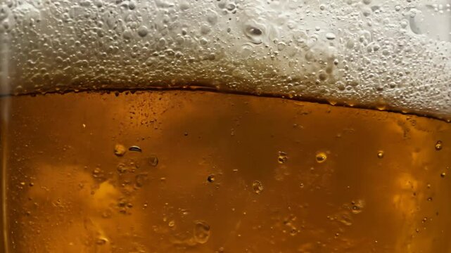 Close-up of beer bubbles and foam