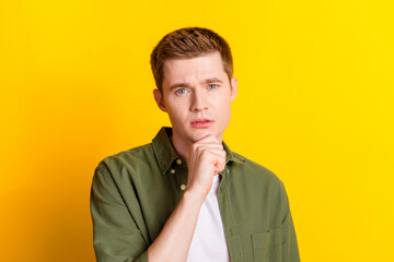 Photo of handsome smart man wear stylish khaki clothes arm touch face isolated on vivid yellow color background