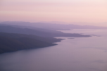 Pebble beaches. Beaches in Muğla. View from the beach to the sea. Magnificent beach, sea and blue cloudy sky.