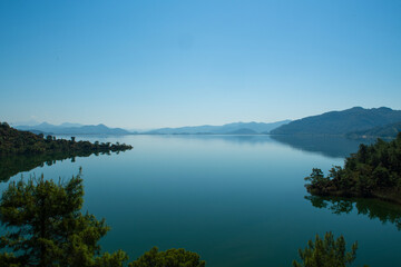 Bay views from green forests. View from the forest to the sea. Magnificent views from the forest to the sea. Magnificent bays of Muğla.