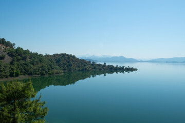 Bay views from green forests. View from the forest to the sea. Magnificent views from the forest to the sea. Magnificent bays of Muğla.