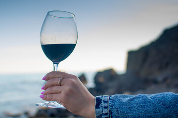 Glass of wine by the sea