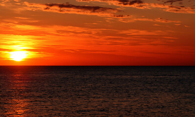 Fototapeta premium a beautiful sunset at sea on the island of Aruba generated with artificial intelligence