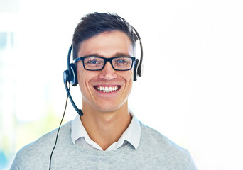Man, headset and portrait in workplace with smile as virtual assistant, communications staff and...