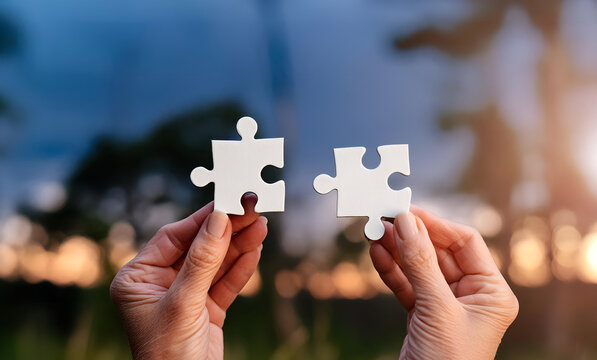 Hands and puzzles, important pieces of teamwork Teamwork concept