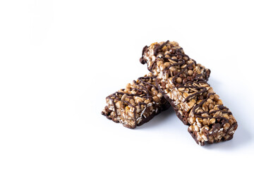 Healthy Muesli bars with nuts and black chocolate isolated on white background. Copy space