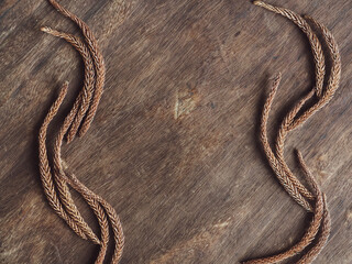 Pine leaves on old brown wood background, vintage style for copy space.        