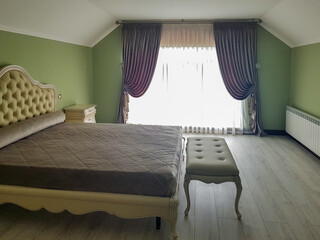 bed and curtains in the bedroom