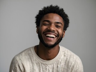 Fototapeta premium Portrait of a blond young man laughing, white background with copy space