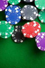 Casino chips on a green mat