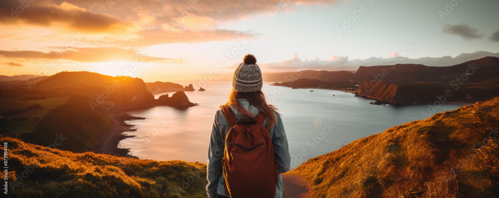 Sticker travel banner of woman hiking on cliff landscape at sunset