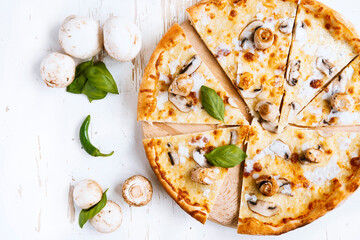 Tasty fresh baked pizza with champignons and chicken fillet