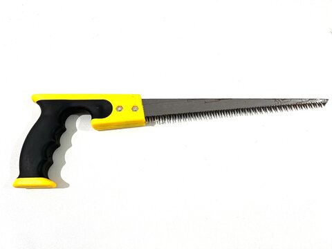 Modern compass saw with black and yellow rubber handle for cutting softer material isolated on white background