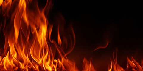 Fire flames on black background. Raging bonfire flames with wood sticks and sparks with horizontal repetition at night. Wood burning flames at night