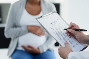 Hands, pregnant woman and doctor with clipboard, documents and appointment for healthcare. Closeup, pregnancy and patient with tummy, medical and professional with paperwork for insurance and review