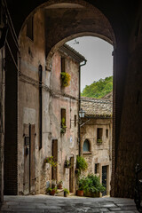 A glimpse of the ancient medieval village of Sorano, on a melancholy and rainy spring day. In the province of Grosseto, Tuscany, Italy. The old houses built in stone and tuff bricks.