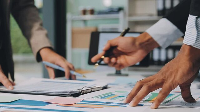 Business meeting time,business account managers crew working with new startup project,report analysis cost graph on desk at meeting room.