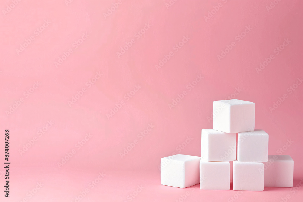 Poster a minimalist composition of four white cubes on a pastel pink background, creating an elegant and cl
