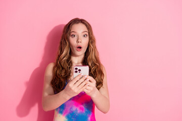 Photo of shiny impresssed lady dressed vintage clothes getting sms modern gadget empty space isolated pink color background