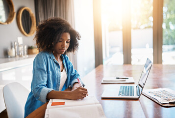 Black woman, laptop and writing on book for education with internet connection, elearning and...