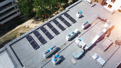 Aerial View of Apartment Building with HVAC and Solar Panels