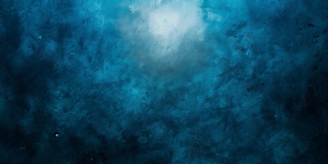 Obraz premium Abstract blue background with bright center spotlight and dark vignette border frame with vintage grunge background texture.
