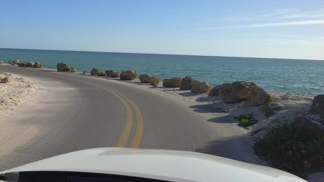 POV driving on Casey Key scenic road in sunny Florida.