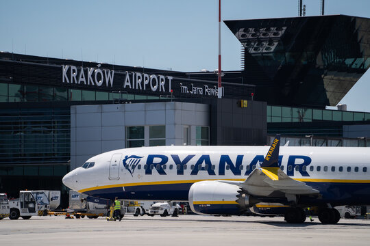 Ryanair Boeing 737 airplane at John Paul II International Krak&oacute;w Balice Airport terminal near Cracow. Irish low-cost airline plane. Ground handling before departure on June 15, 2024 in Krakow, Poland