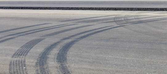 A road with tire tracks on the asphalt © yakowiric1959