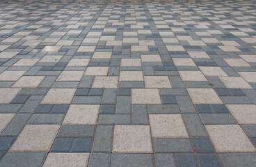 A large, empty tiled floor with a checkered pattern