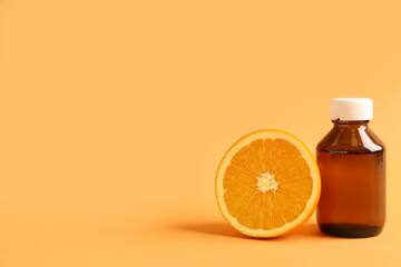 Cough syrup with orange on color background
