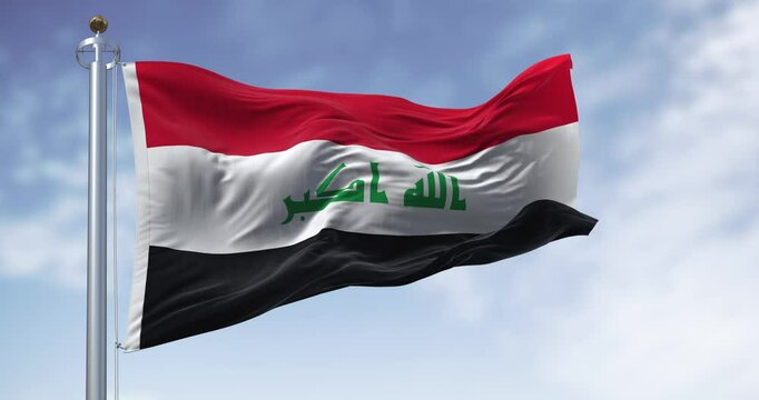 Republic of Iraq national flag waving on a clear day