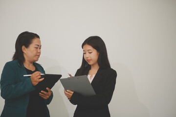 Pretty Asian female lawyer working and hammer, laptop, justice advice and legal concept. In office