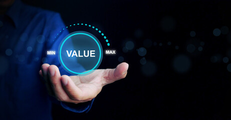 Business value added concept. A man holds a virtual icon of increasing value added to the product,...