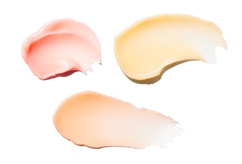 Lip balm (or make up cleansing oil butter balm washer) assortment set swatches multi colored orange yellow and pink isolated on white