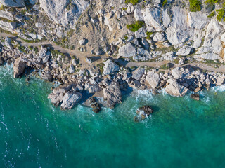 Aerial view of sea waves and rocks on the coast. Adriatic sea and coast of Croatia