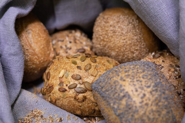 A basket overflowing with freshly baked bread rolls