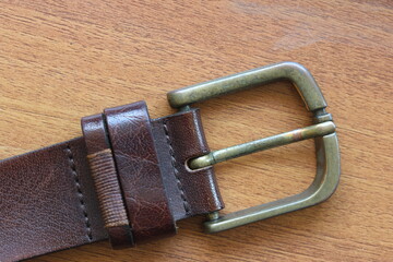 leather belt isolated on brown