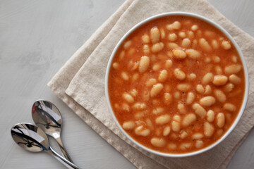 Bowl of Canned White Beans with Tomato Sauce, top view. Copy space.