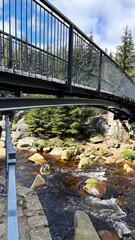 Mountain river border of Poland and the Czech Republic, flowing water in the Polish Sudeten Mountains