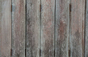 Walls of an old wooden house are nailed together.