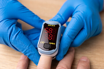 Saturation (the level of oxygen in the blood) is measured using a pulse oximeter.