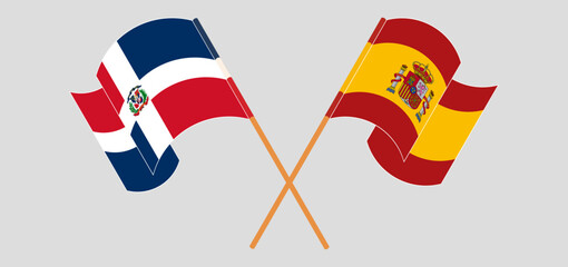 Crossed and waving flags of Dominican Republic and Spain