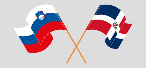 Crossed and waving flags of Slovenia and Dominican Republic